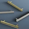 Poignée de meuble arrondi GoodHome Garlan aluminium effet laiton satin doré l.168mm x l.15mm x H. 27mm entraxe 128mm
