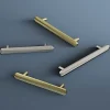 Poignée de meuble arrondi GoodHome Garlan aluminium effet laiton satin doré l.136mm x l.15mm x H. 27mm entraxe 96mm