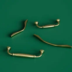 Poignée de meuble nœud GoodHome Ruis effet laiton doré l.116mm x l.20mm x H. 38mm entraxe 96mm